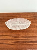 Top view of frosted glass dish showing cherry motif and divider