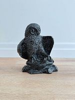 Front view of carved soapstone owl on base