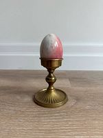 Marble egg displayed on a brass stand (stand not included)