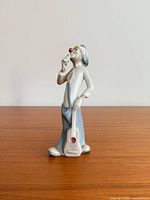 Full view front of Casades porcelain clown figurine with guitar