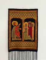 Front view close of kilim tapestry showing figures and fringe