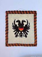 Front view of rectangular latch hook eagle tapestry
