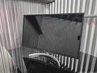 Front view of LG 32-inch monitor on curved stand