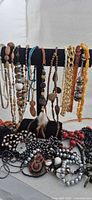 Full lot on display stand showing variety of necklaces