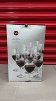 Front of box showing wine glasses image and branding