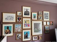 Wall display showing all 20 gold-tone glass frames in various sizes