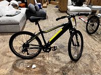 Side view of entire e-bike showing frame, wheels, motor and colour scheme