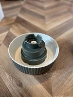 Ceramic bowl with teal plastic fountain tower assembled