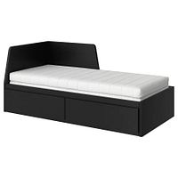 Stock photo of IKEA Flekke bed frame with mattress and drawers closed