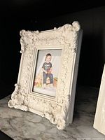Ornate distressed white frame with 5x7 opening