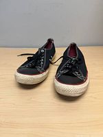 Front view of both shoes showing condition and style