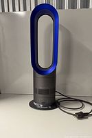 Front view of Dyson AM04 heater fan with cord