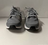 Front view of both sneakers showing uppers and laces