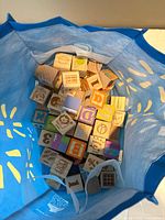 View into bag showing bulk of wooden alphabet blocks