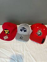 All three caps side by side