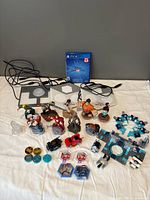All items laid out: PS4 game, three portal bases, figures, power discs, vehicles, platform pieces