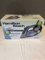 Front view of boxed Hamilton Beach Durathon electronic iron