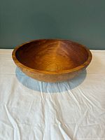 Top angled view of wooden salad bowl