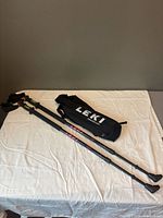 Full view of both LEKI walking poles and carry bag