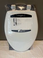 Front view of sealed Mayfair elongated toilet seat