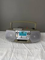 Front view showing speakers, controls and cassette door