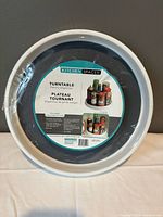 Front view of sealed Kitchen Spaces turntable pantry organizer in original shrink wrap