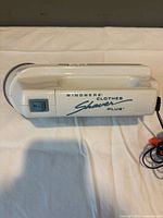 Right side view of Windmere Clothes Shaver Plus showing branding and power switch