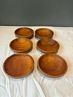 top view of six wooden bowls