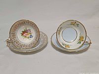 Both Paragon teacup and saucer sets displayed together