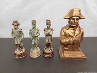Front view of bust and three soldier decanters