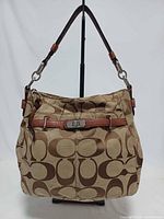 Front view of Coach Chelsea Ashlyn handbag showing design and condition