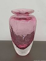 Front view of pink and clear crackle texture glass vase