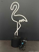 Front view of LED flamingo lamp with power adapter