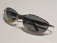 Three-quarter front view of sunglasses showing frame and lens tint