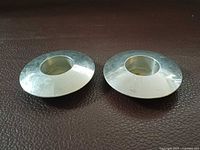 Top view of both Georg Jensen stainless tealight holders