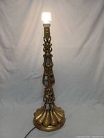 Lamp lit, showing full height and gilded carving