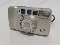 Front view of Minolta 110 Zoom Date camera with lens retracted