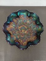 Top view showing iridescent Good Luck pattern and ruffled edge