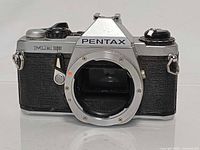 Front view of Pentax ME Super body showing open K-mount and controls