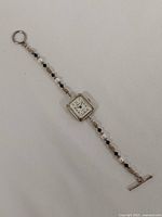 Full view of watch laid flat