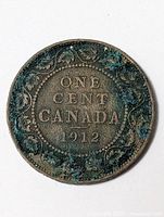 Reverse showing ONE CENT CANADA 1912 with corrosion