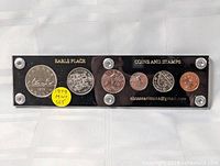 Front view of acrylic holder showing all six coins