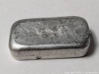 Front angled view of rectangular pewter ingot