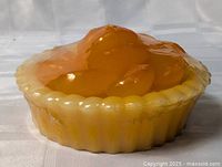 Side view of sealed pie-shaped candle