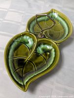 Top view showing full double-leaf dish and handle