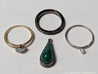 Group shot of four jewelry items