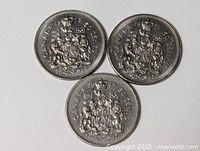 Group shot of three Canadian 50-cent coins