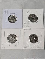 Front view of all four 5-cent coins in flips marked 1971, 1990 Normal, 1977 Low-7, 2000-P