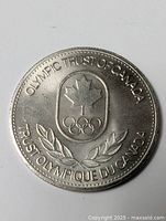 Obverse showing Olympic Trust of Canada emblem