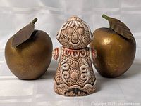 Front view gold apple ornaments and gingerbread shaker